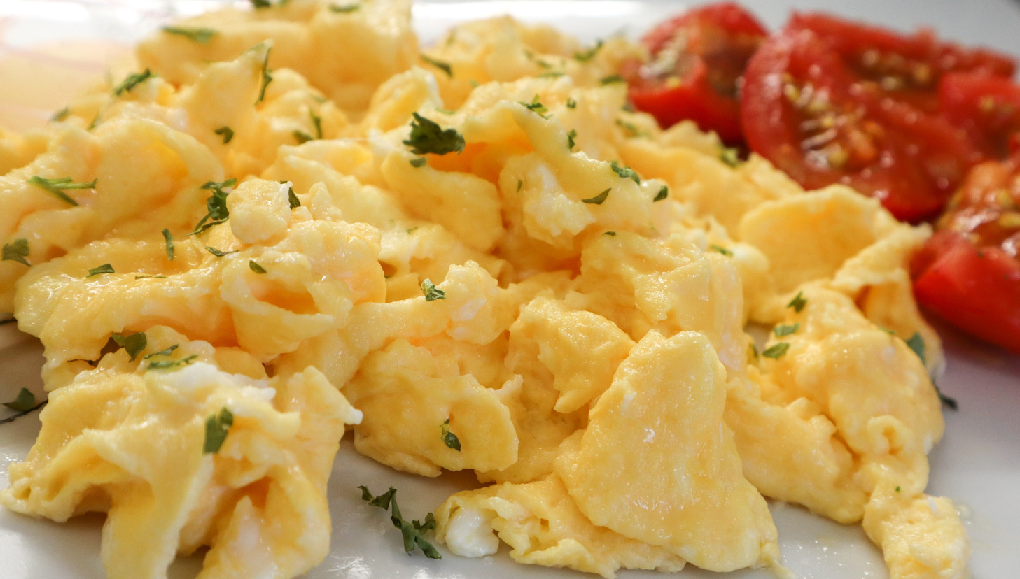 Plate of Scrambled Eggs and Tomatoes